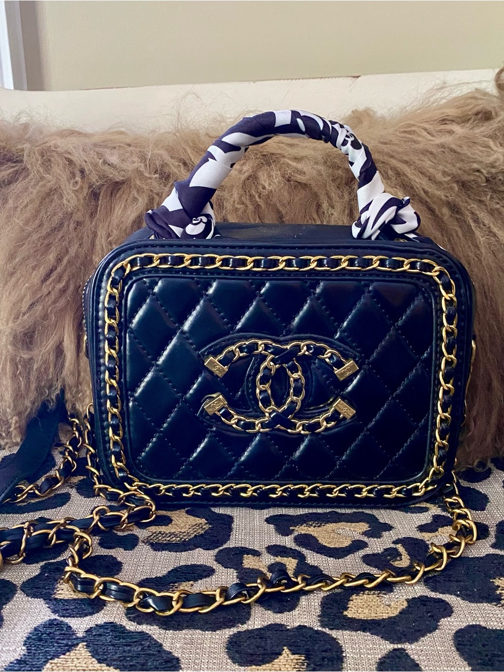Black and gold quilted camera style C c top handle fashion bag